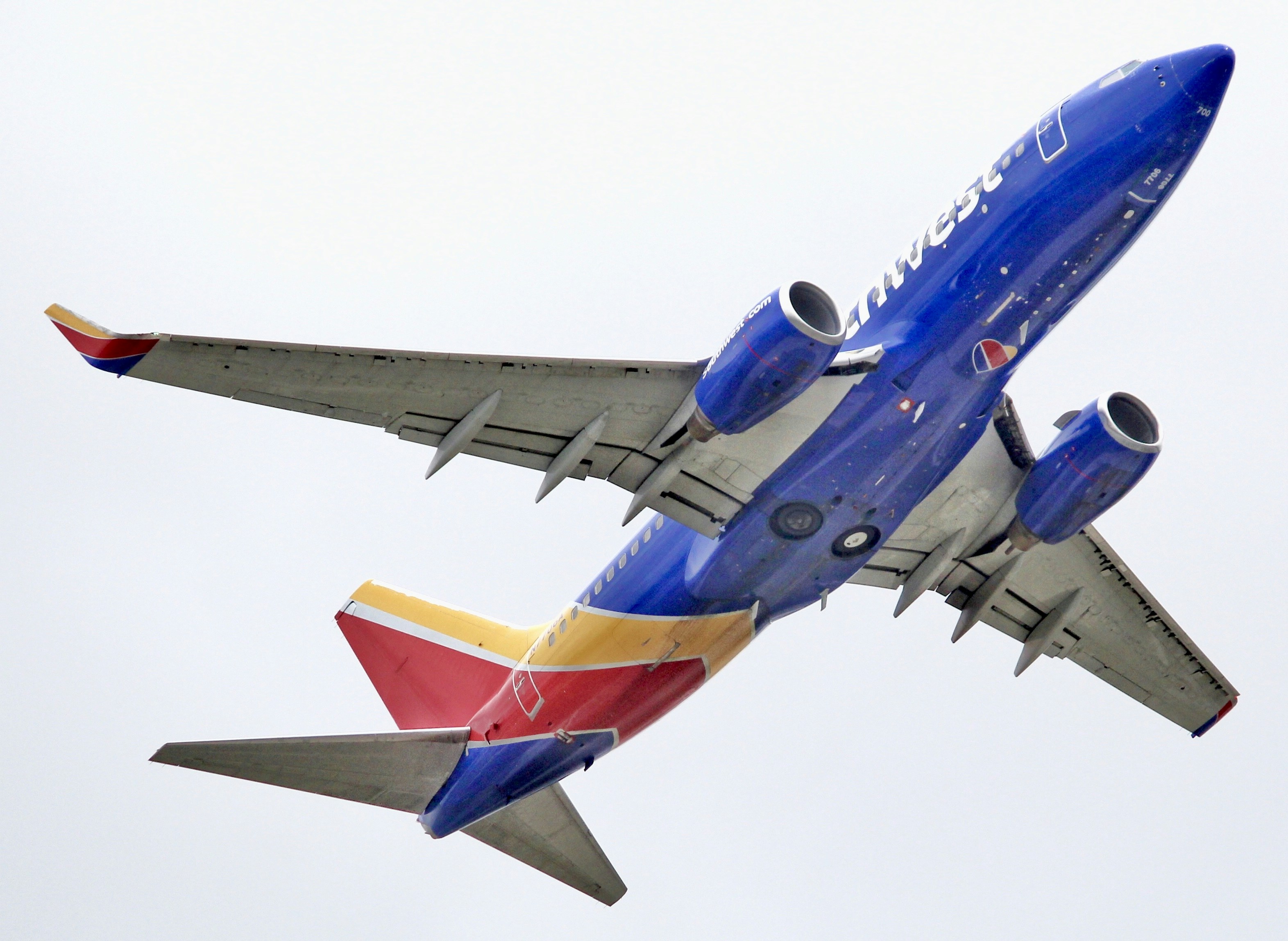 blue and red airplane in mid air during daytime, Southwest 737 climbing out of BWI