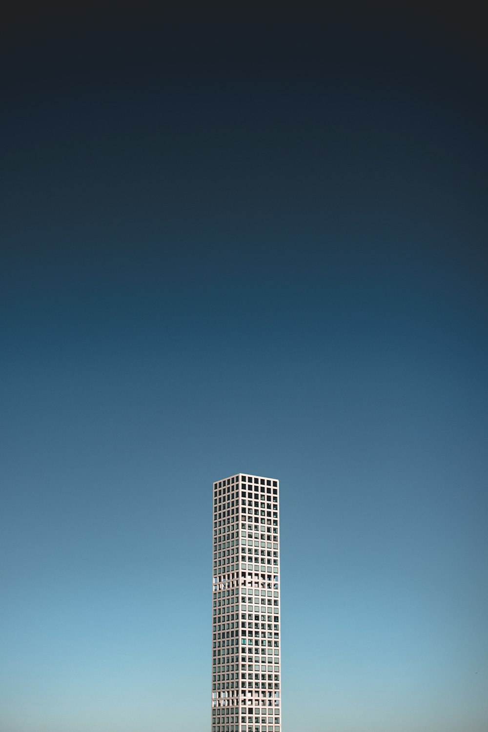 white high rise building under blue sky during daytime