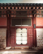 Finished Prominence door installed on a traditional Bihar house entrance.