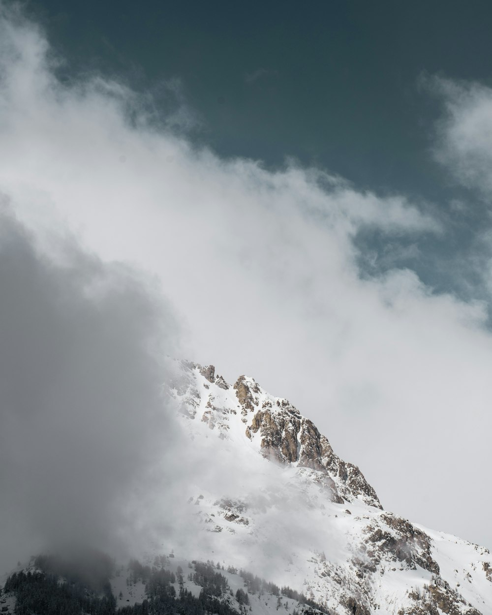 snow covered mountain under blue sky during daytime