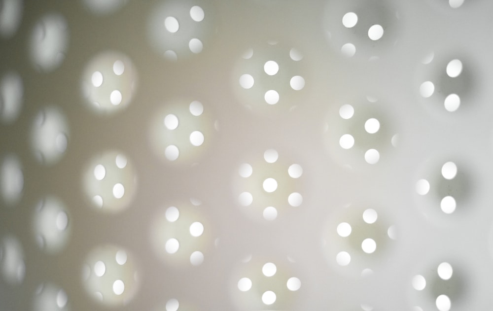 white and silver polka dot textile