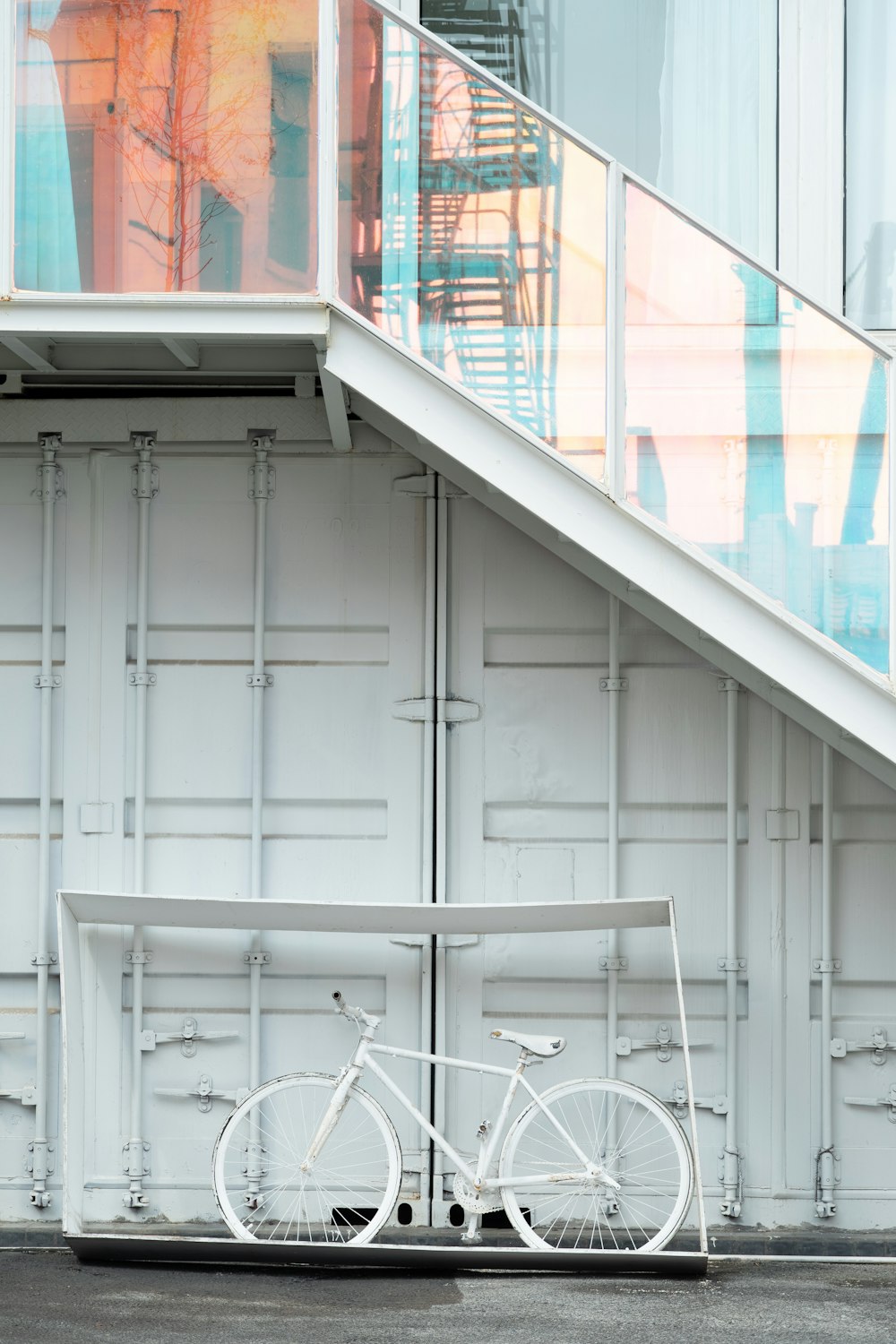 white metal chairs on white wooden door