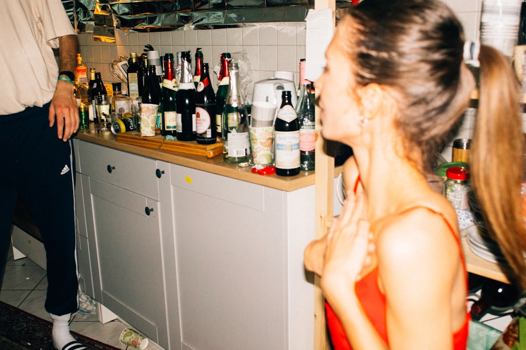 woman in white tank top sitting on chair, Random party impression