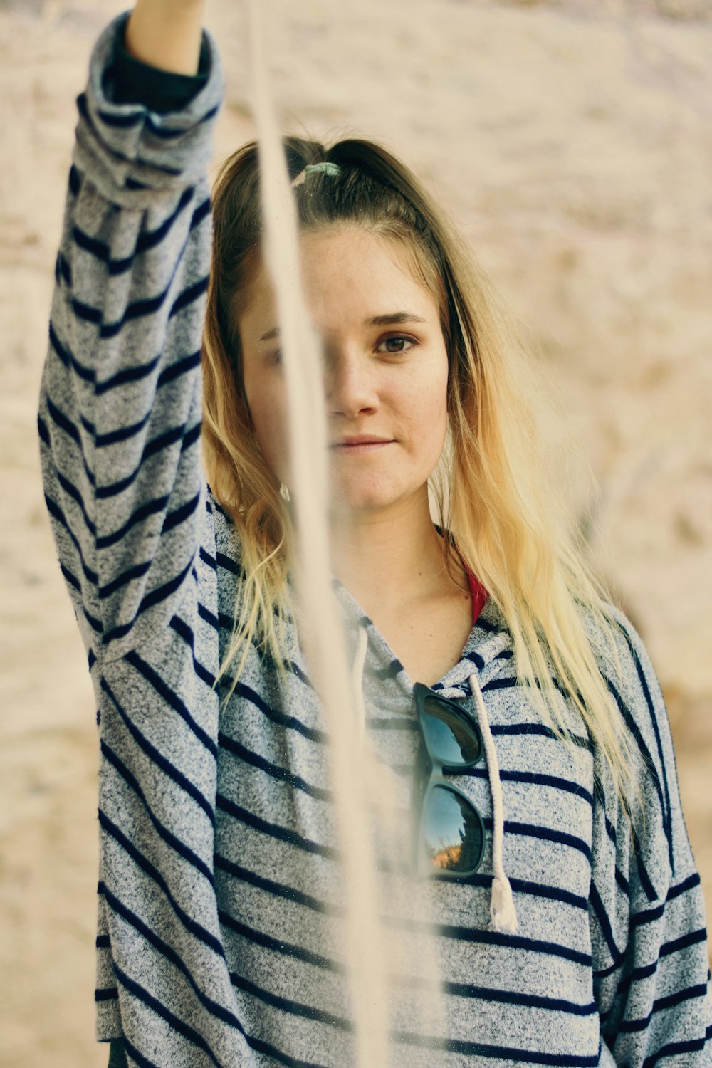 woman in black and white striped long sleeve shirt