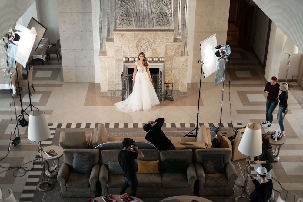 bride and groom sitting on gray couch