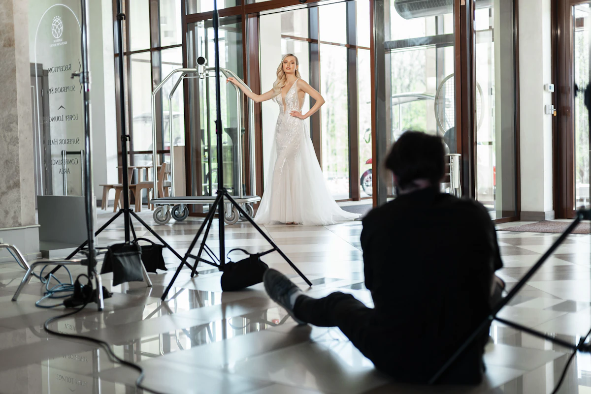Couple sharing a moment at their wedding while the photography team works quietly