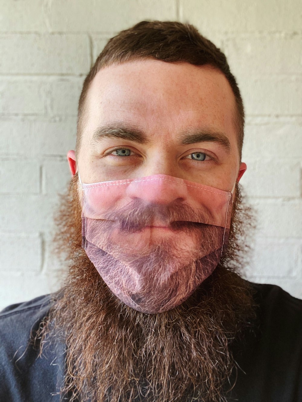 man in black crew neck shirt with white and red face paint