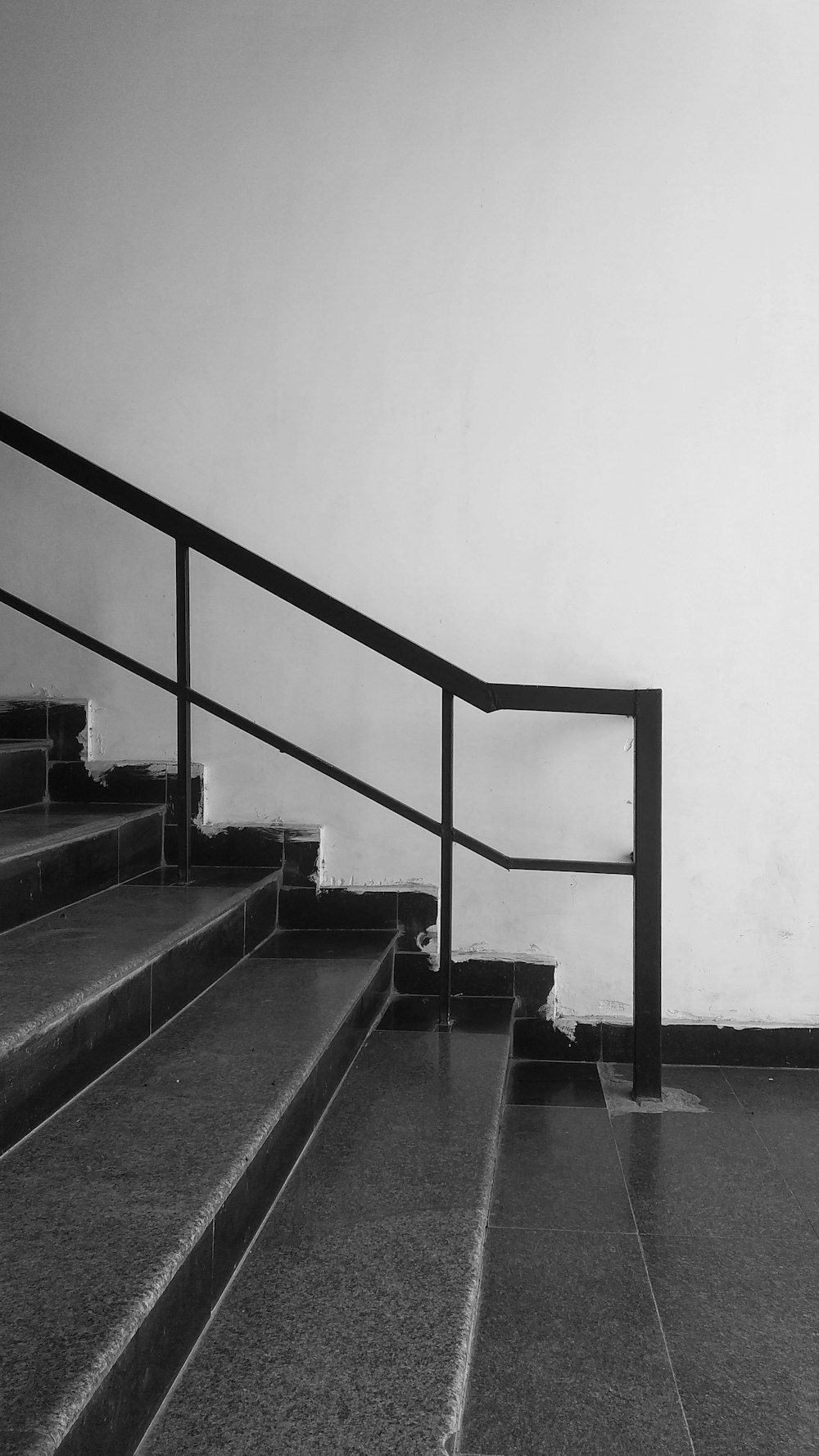 black staircase in grayscale photography