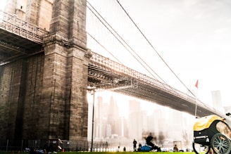people walking on bridge during daytime
