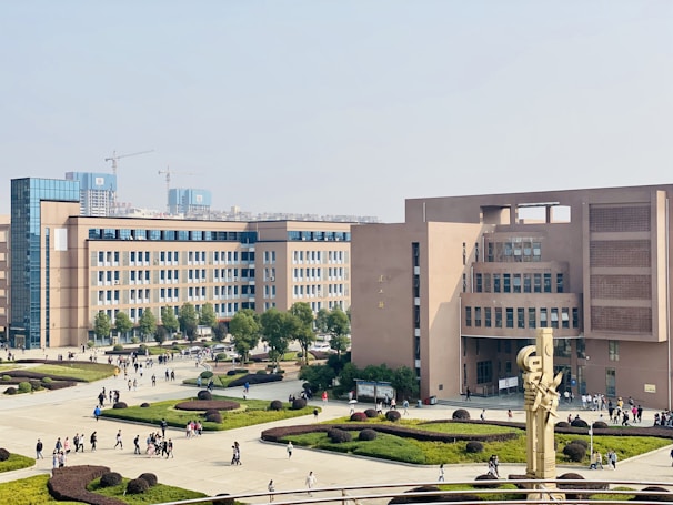 people walking on park near building during daytime