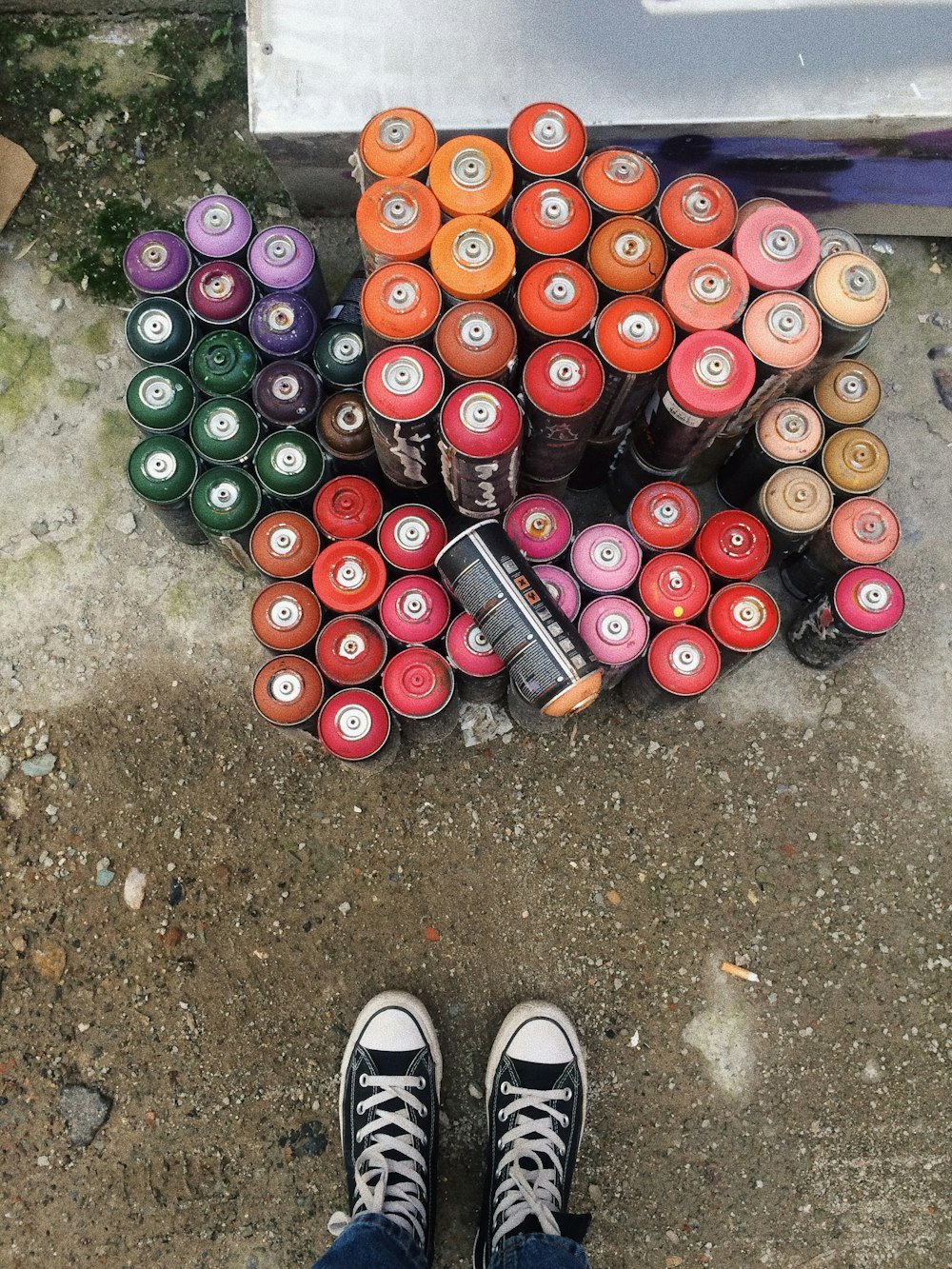 black and red can on floor