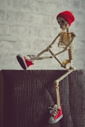 gold and red skeleton figurine