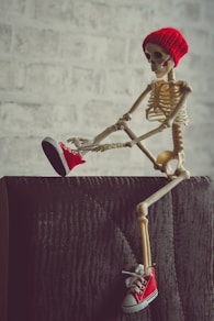gold and red skeleton figurine