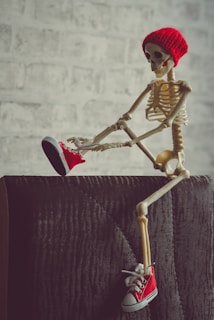 gold and red skeleton figurine