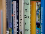 books on brown wooden shelf