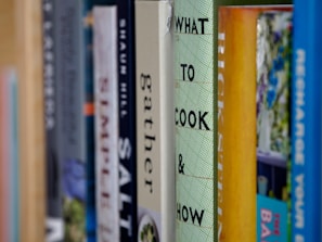 books on brown wooden shelf