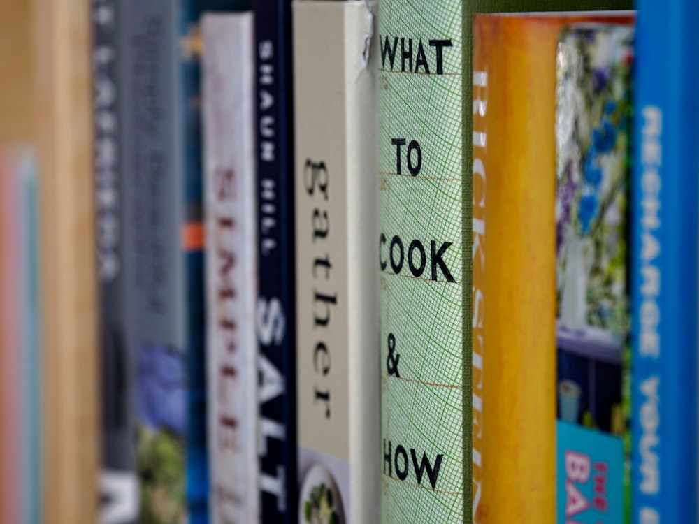 books on brown wooden shelf