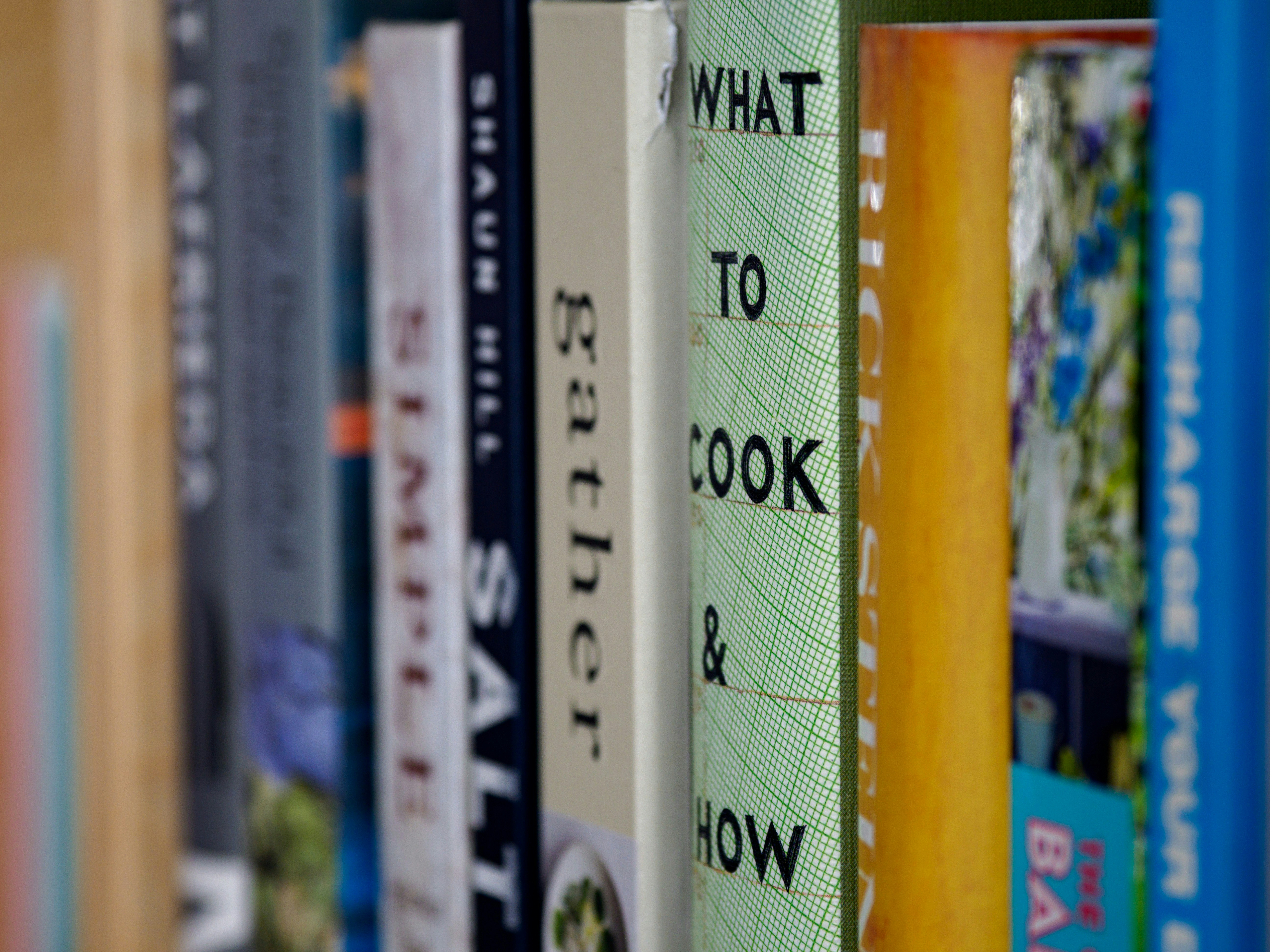 books, bookcase, book spine, close up, bokeh, home, reading, library,