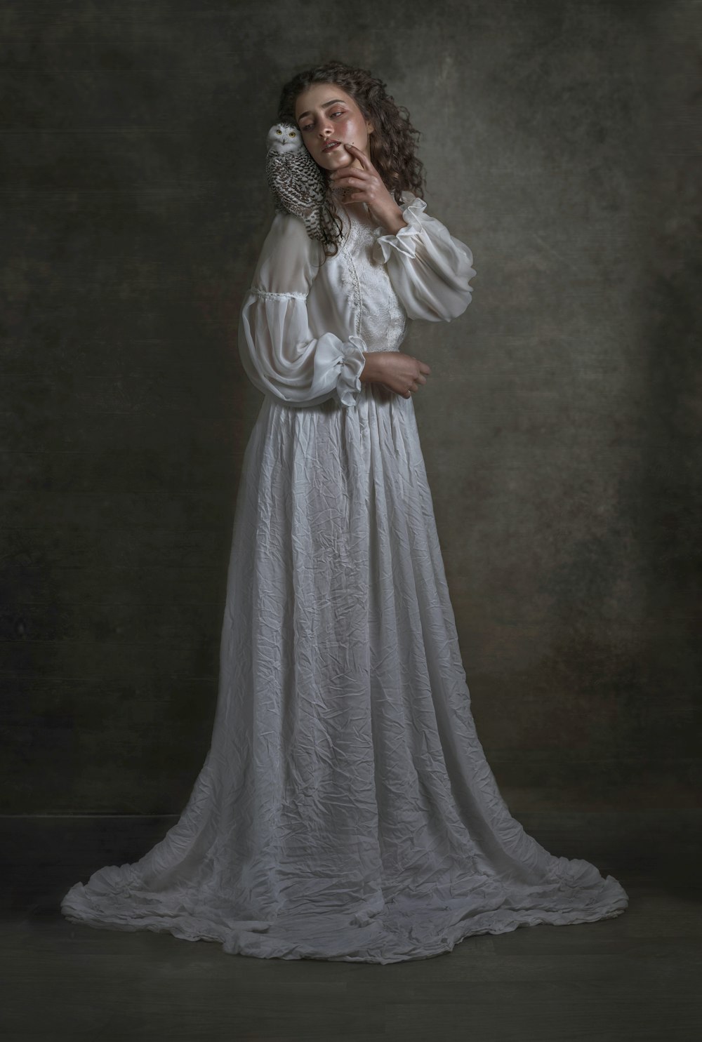 woman in white dress wearing silver tiara