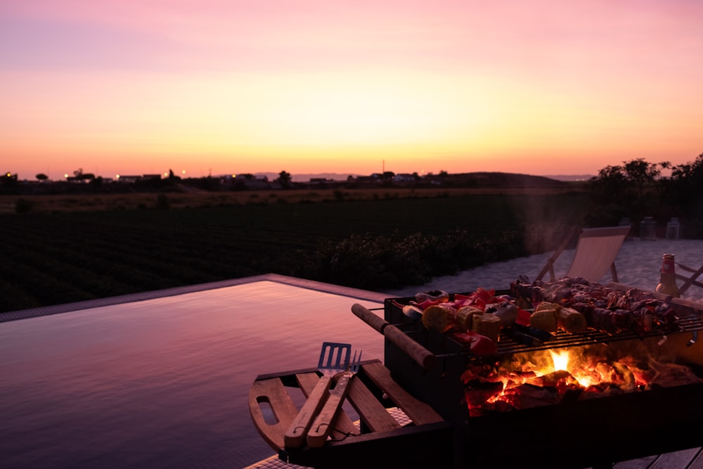 fire on fire pit during sunset