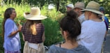Members enjoying a relaxed outdoor discussion on a sunny day.