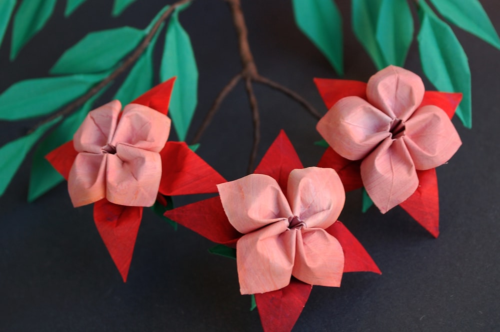 red and white ribbon on black textile