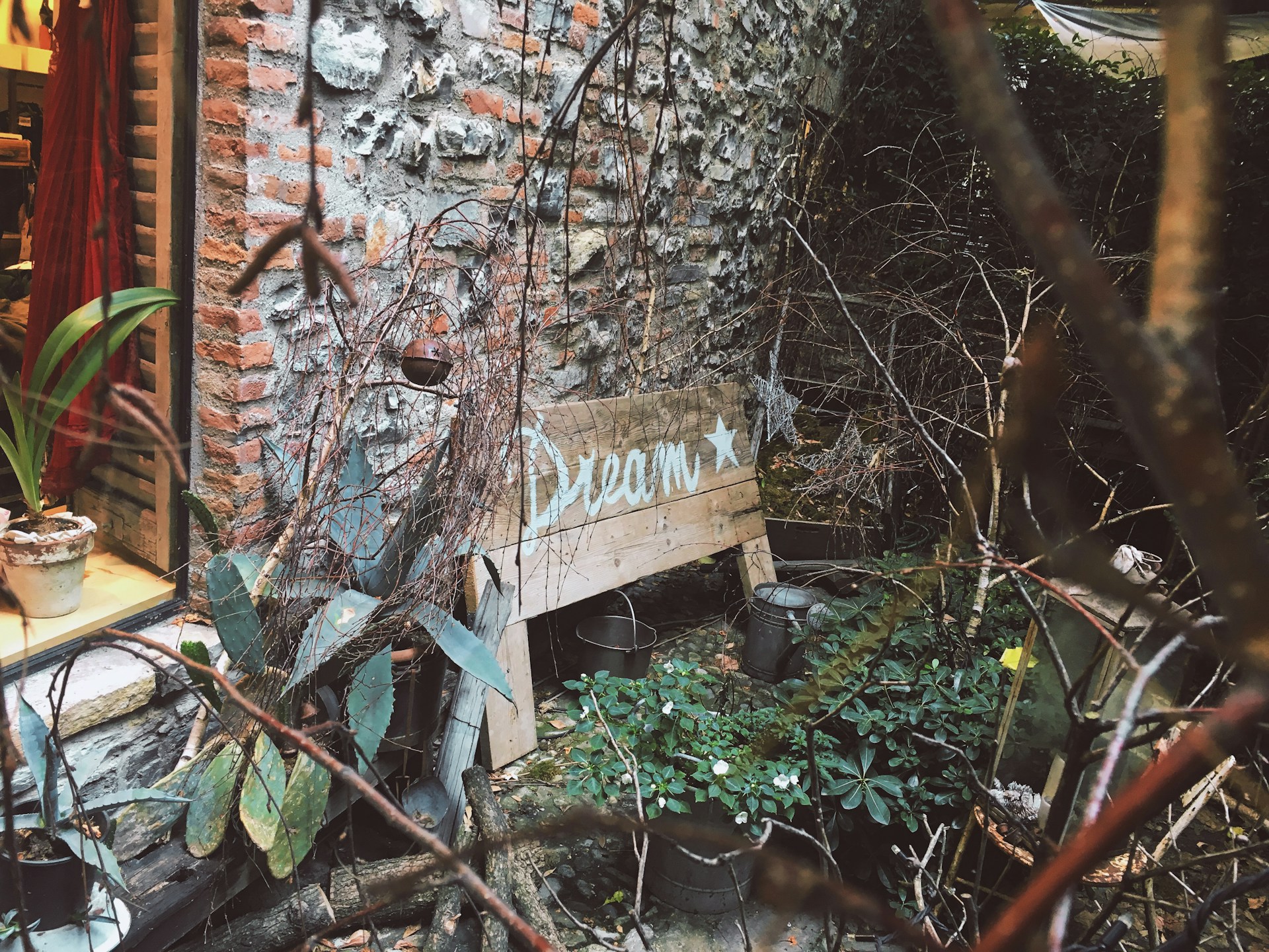 woman wearing yellow long-sleeved dress under white clouds and blue sky during daytime
