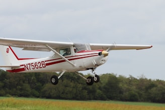 white and red airplane on mid air during daytime