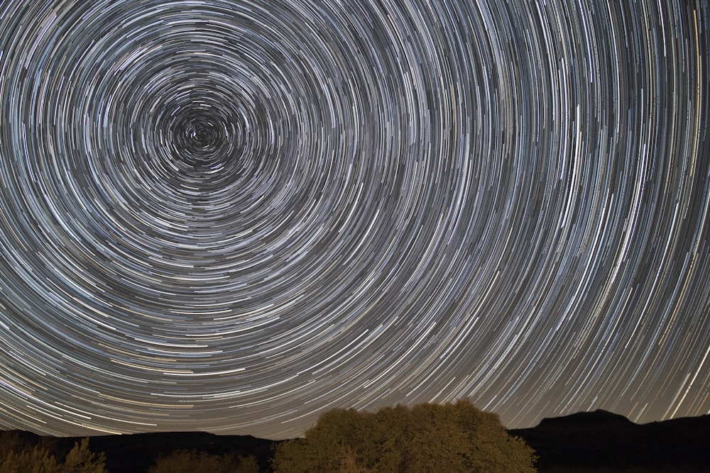 time lapse photography of stars in the sky during daytime