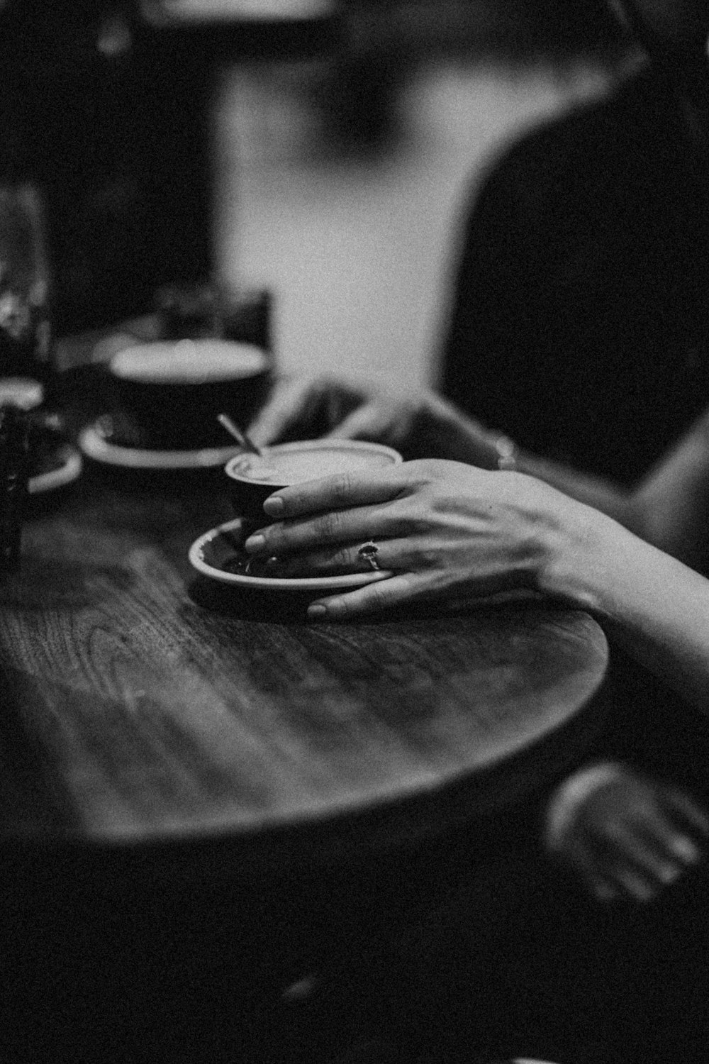 grayscale photo of person holding round plate