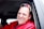 man in red dress shirt wearing black sunglasses