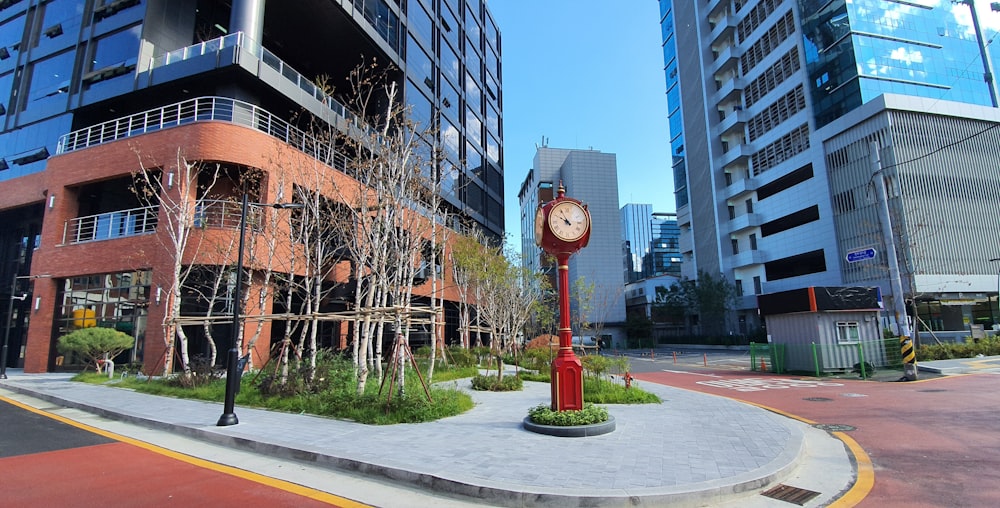 red and white street lamp near brown concrete building during daytime