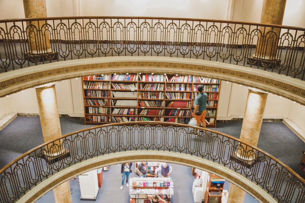 people walking inside library during daytime