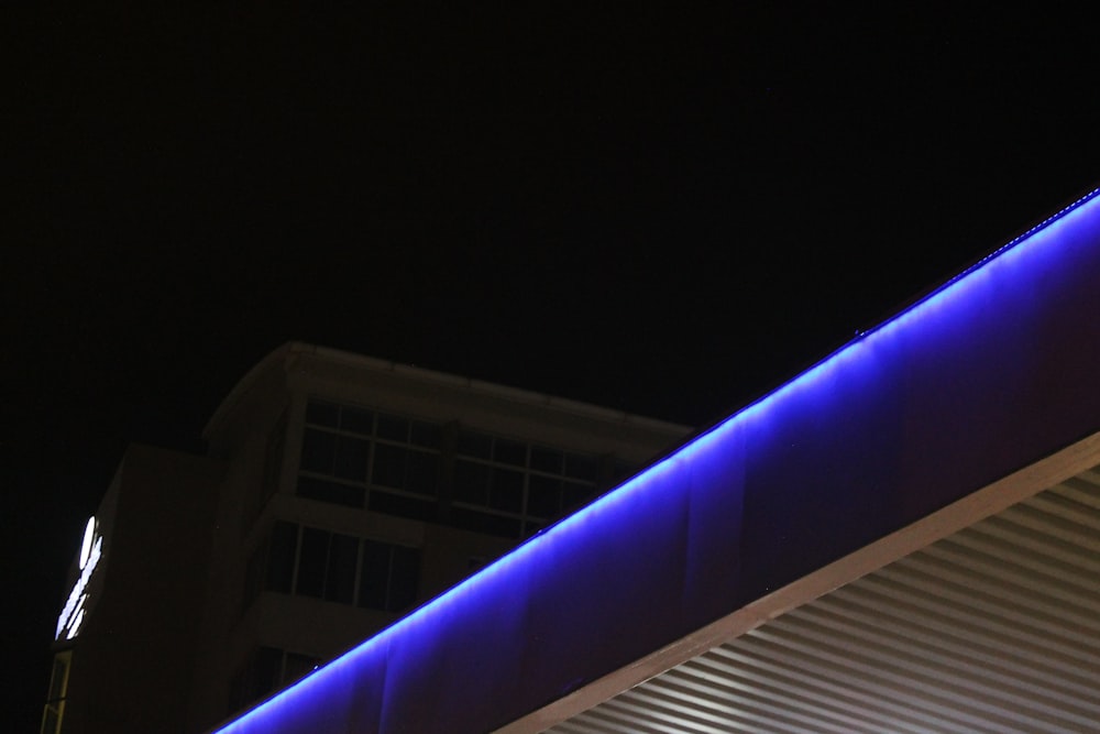 white and purple lighted building during nighttime