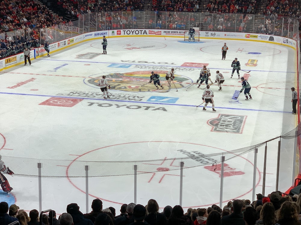 people playing ice hockey on stadium