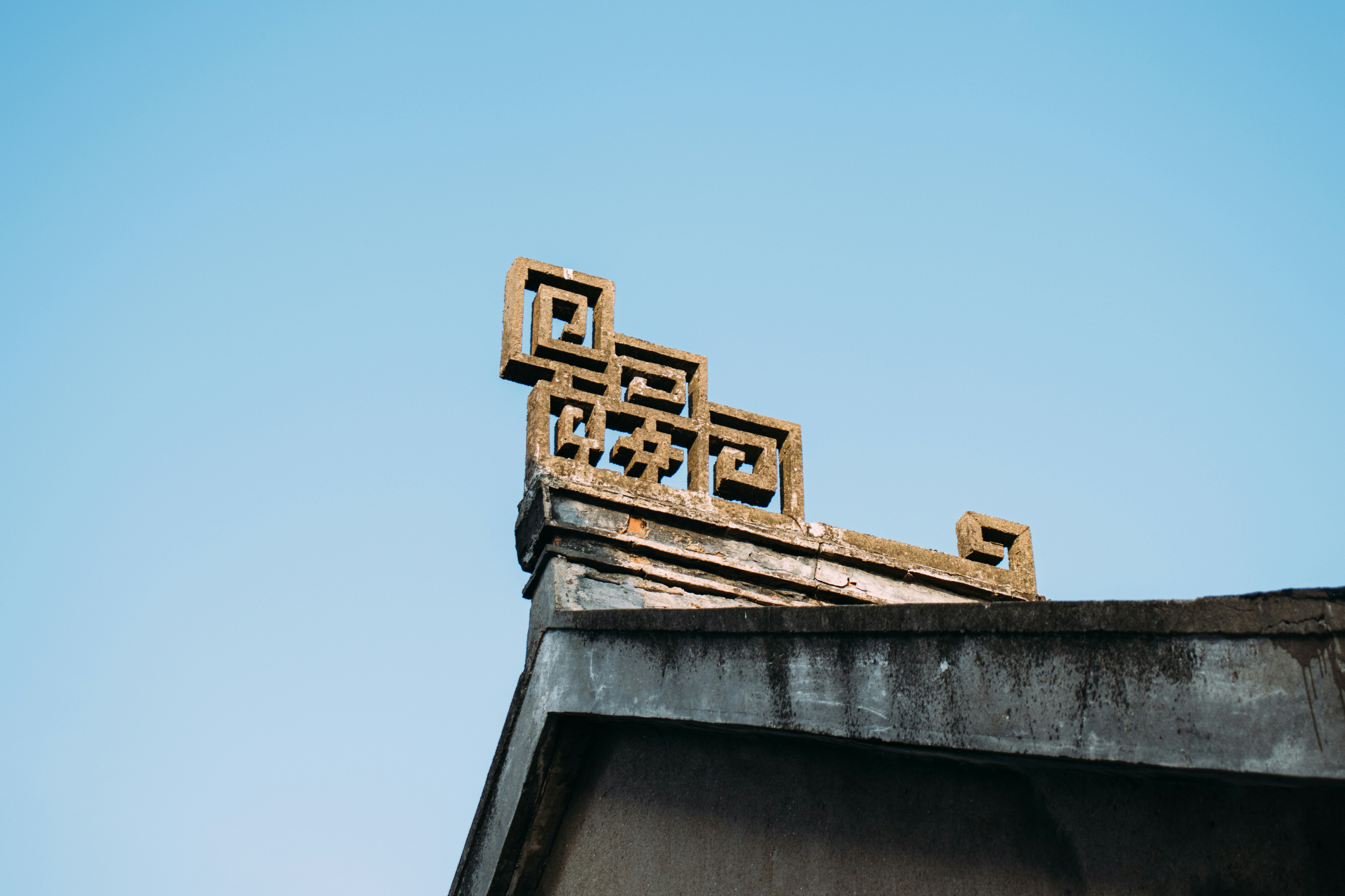 brown concrete building under blue sky during daytime