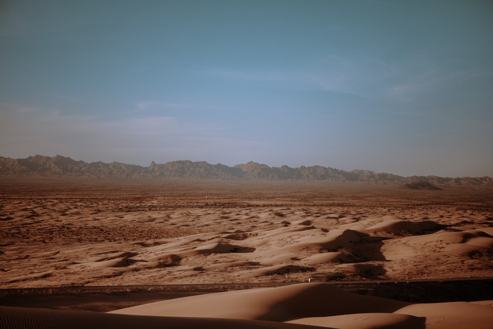 brown sand under blue sky during daytime