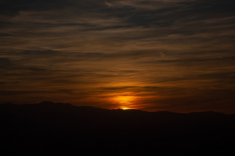 silhouette of mountain during sunset