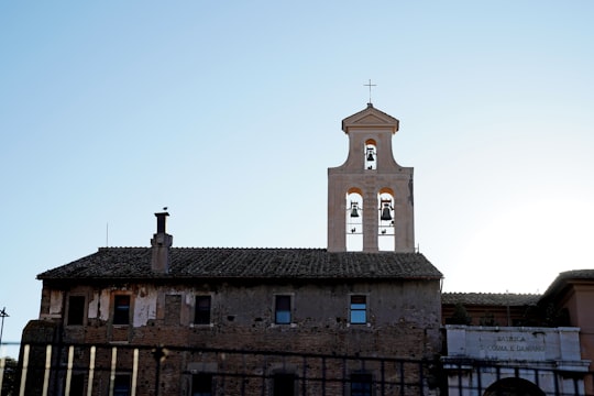 brown concrete church under blue sky during daytime in Santi Cosma e Damiano Italy