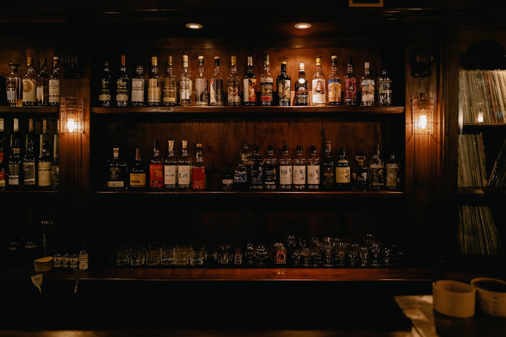 brown wooden shelf with bottles