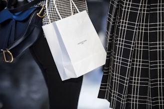 white paper bag on blue and white textile