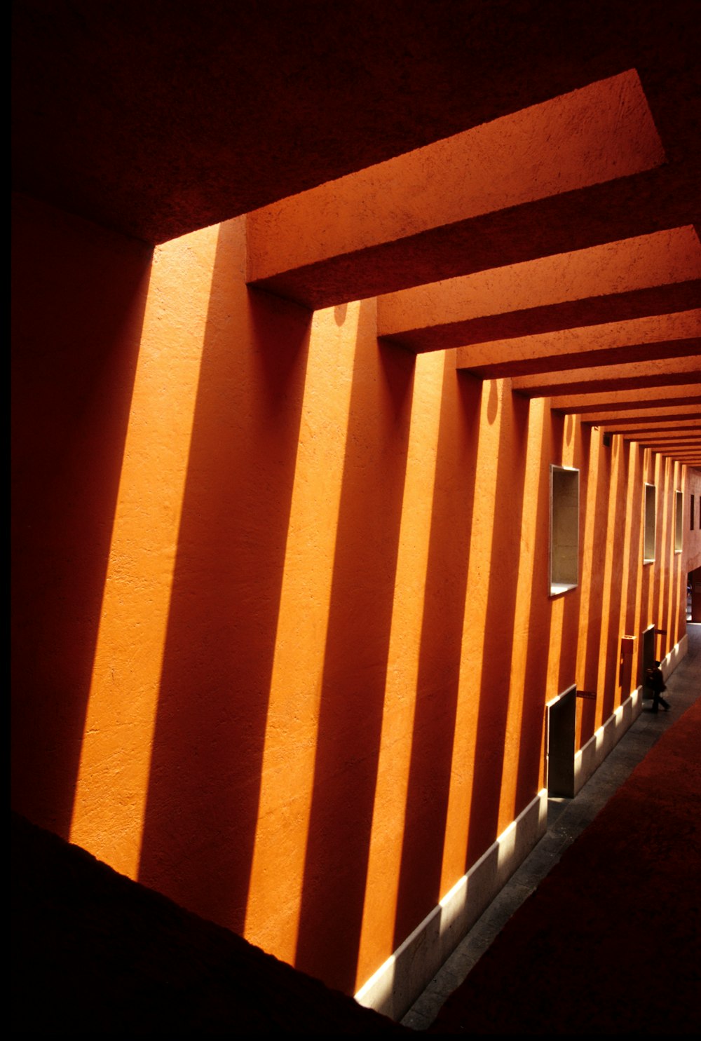 brown and white hallway with brown walls