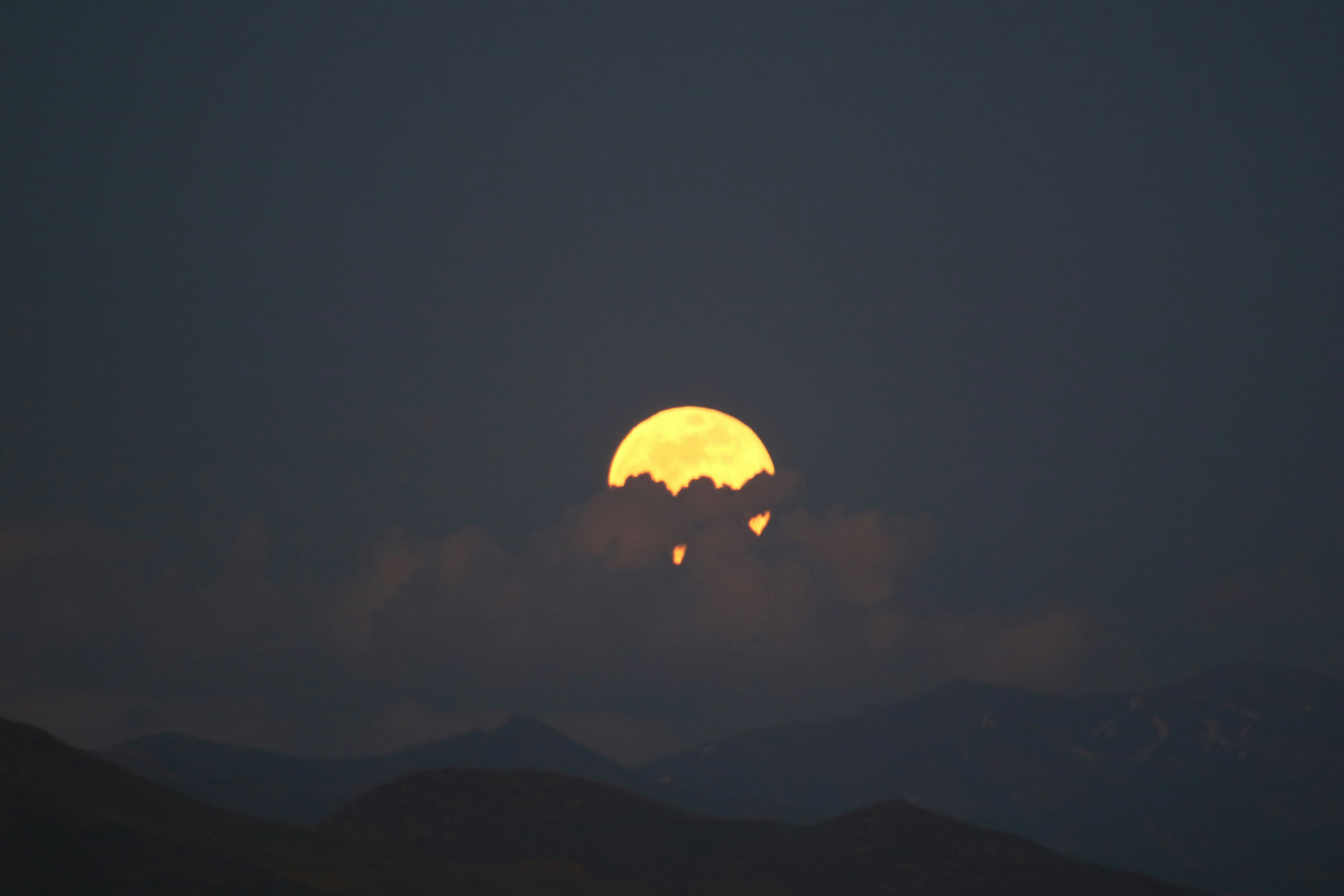 silhouette of mountain during sunset