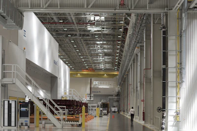 Industrial factory floor with harmonious layout guided by mahavastu principles.