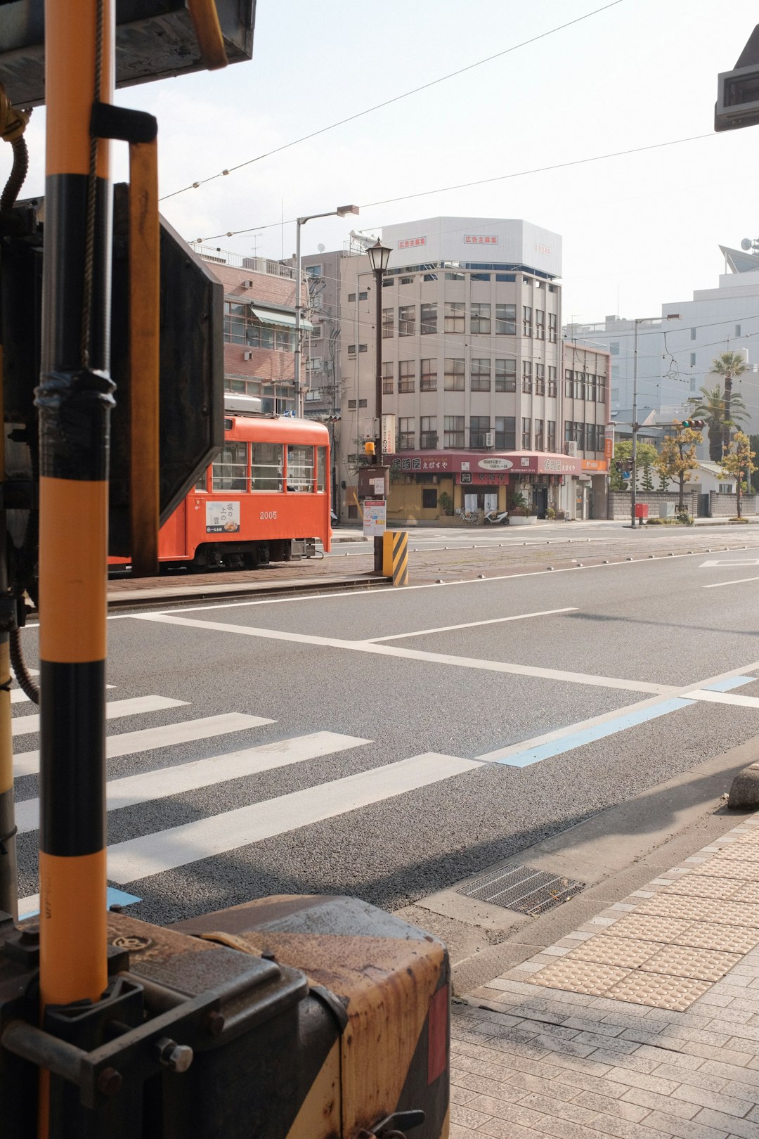 orange and black bus on road during daytime