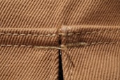 Close-up of soft fabric textures and stitching details on a selection of indova apparel.