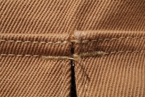 Detailed shot of the unique stitching and fabric texture on one of the signature Colombian shirts.