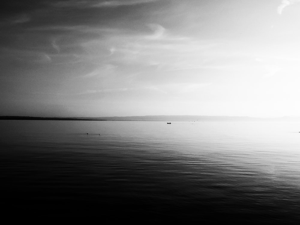 grayscale photo of body of water