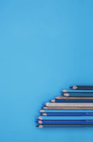 A stack of colorful pencils from the Mile High Hot Yoga pencil shop, inviting creativity.