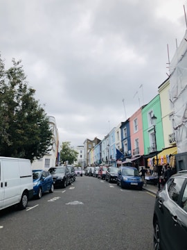Street view of a colorful retail building in a busy shopping district.